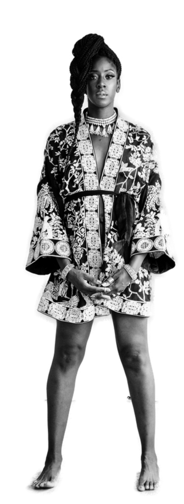 A black and white photo of a woman in a kimono.