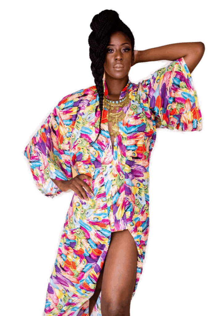 A black woman in a colorful kimono posing on a white background.